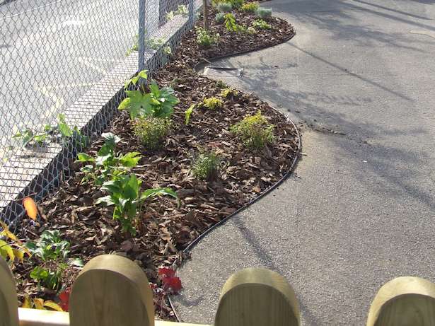 Case Study - Marsham Primary School cutting in new flower beds around the Playground